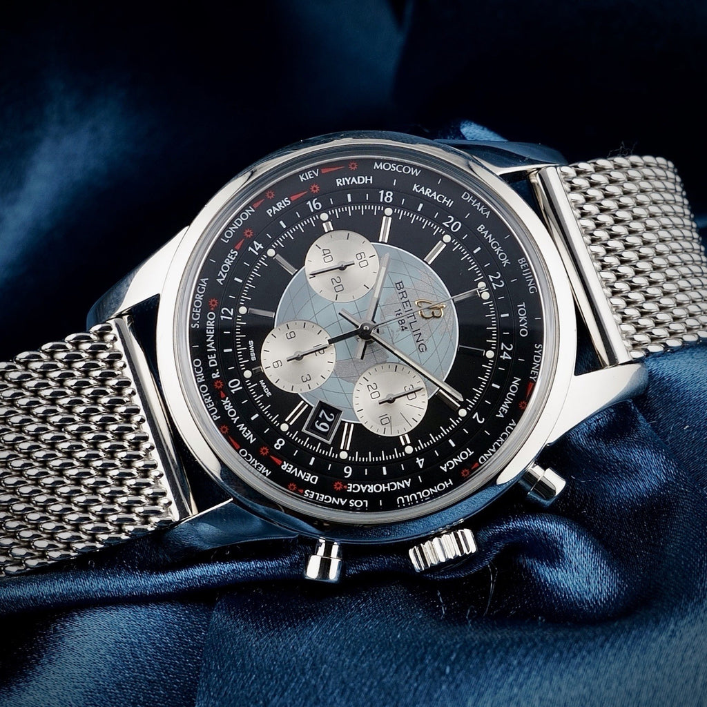 Breitling Transocean Unitime AB0510 – World Time Chronograph B05