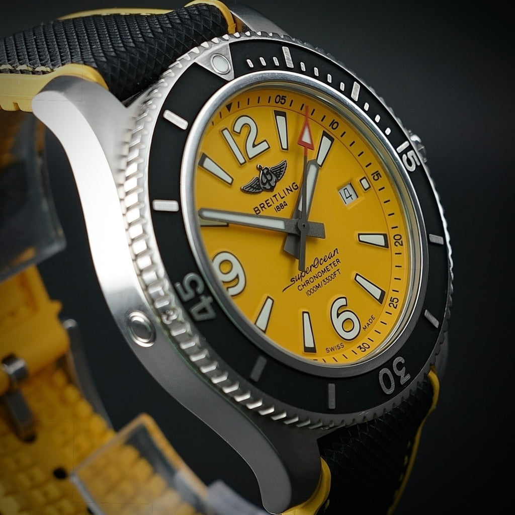 Breitling Superocean A17367 44mm Yellow Dial Steel Bracelet — wrist shot on stainless steel bracelet