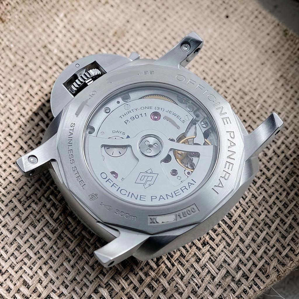 Panerai PAM01033 sapphire exhibition caseback showing the P.9011 automatic movement and power-reserve indicator
