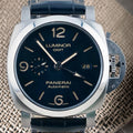 Panerai Luminor GMT PAM01033 front view with blue sandwich dial, 44mm stainless steel case and blue strap