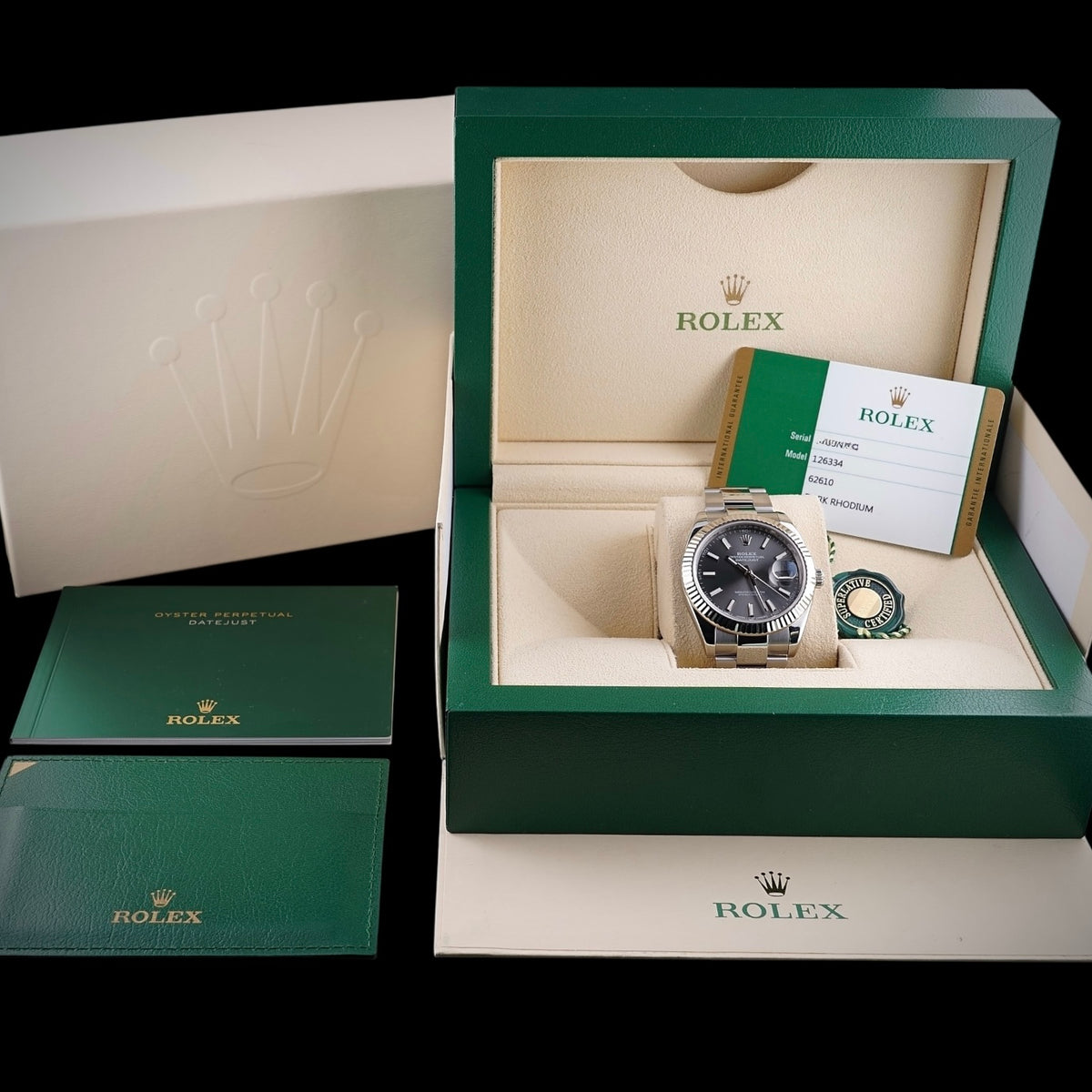Rolex Datejust 41 with presentation boxes, paperwork and accessories displayed together.