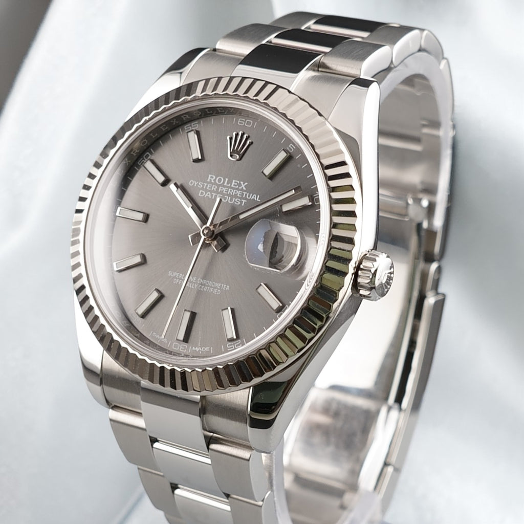 Three-quarter view of Rolex Datejust 41 126334 showing the slate dial, fluted bezel and Oyster bracelet.