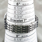 Wrist Flex Timepieces Breitling Navitimer 36 stainless steel watch bracelet on a sizing cone showing size 7 inches