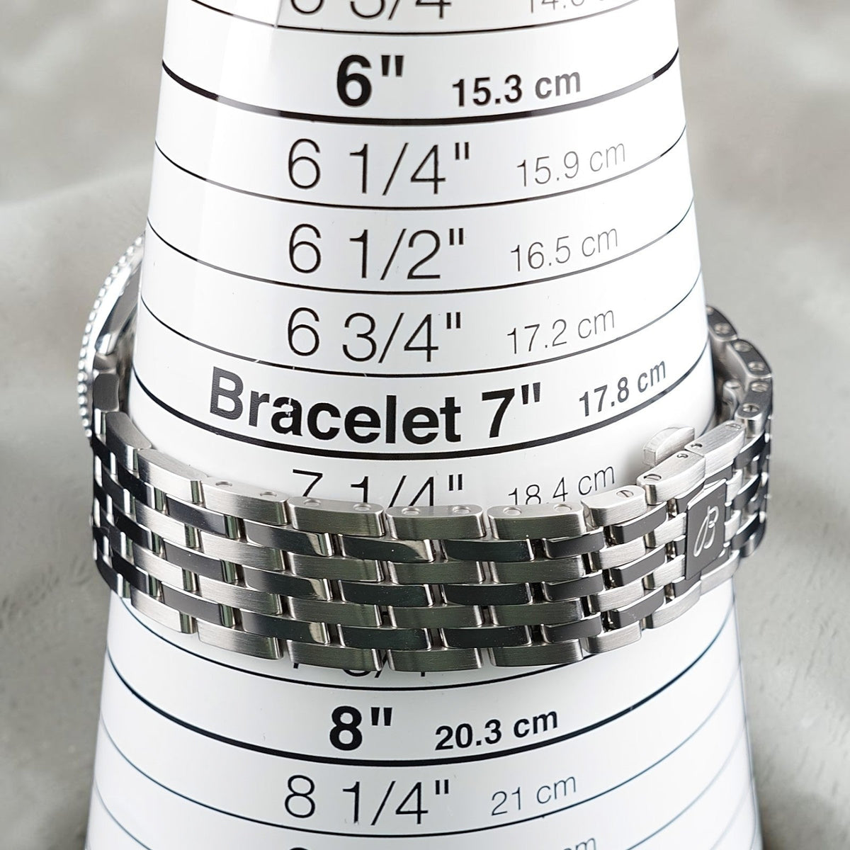 Wrist Flex Timepieces Breitling Navitimer 36 stainless steel watch bracelet on a sizing cone showing size 7 inches