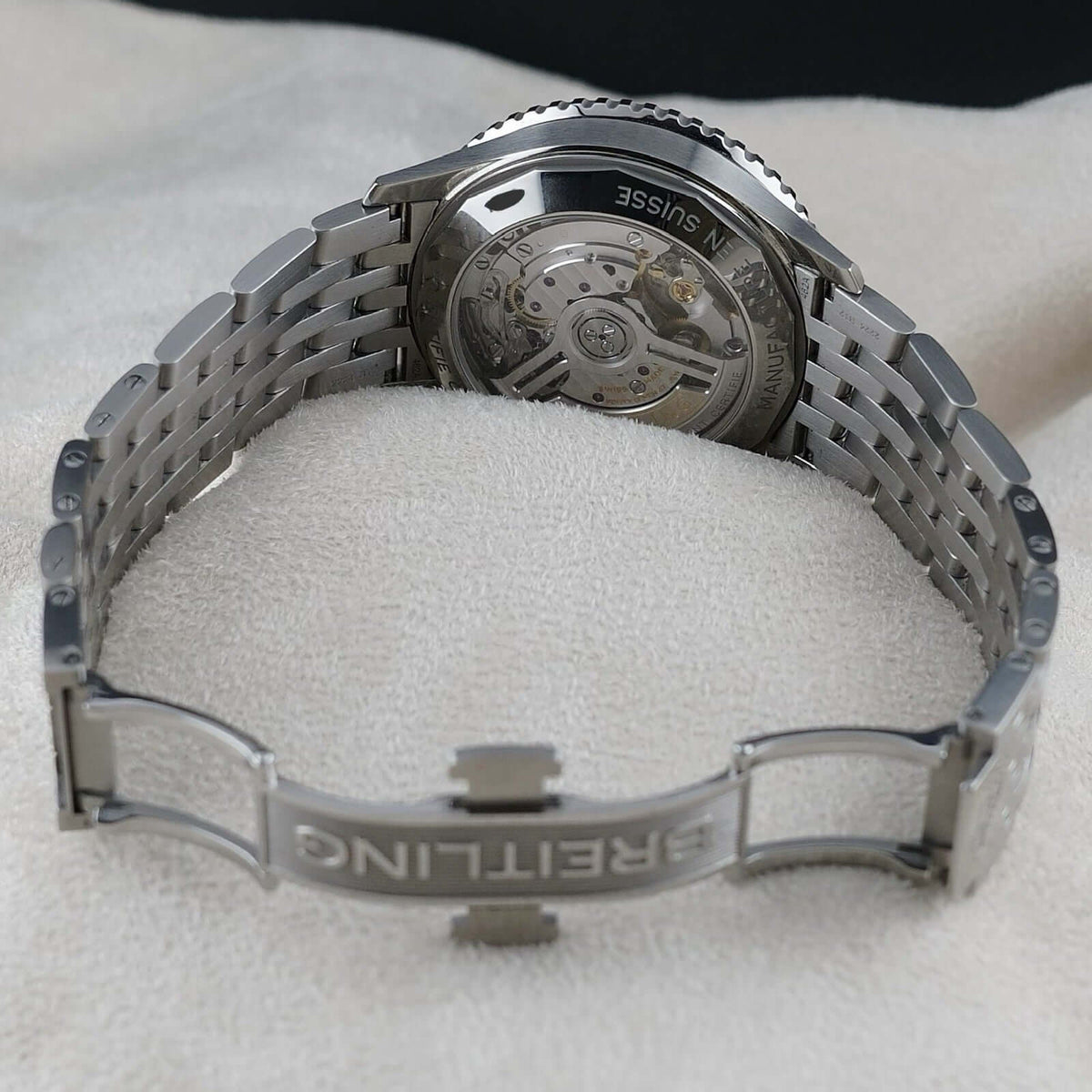 Wrist Flex Timepieces Breitling Navitimer stainless steel watch showing the exhibition caseback and rouleaux bracelet