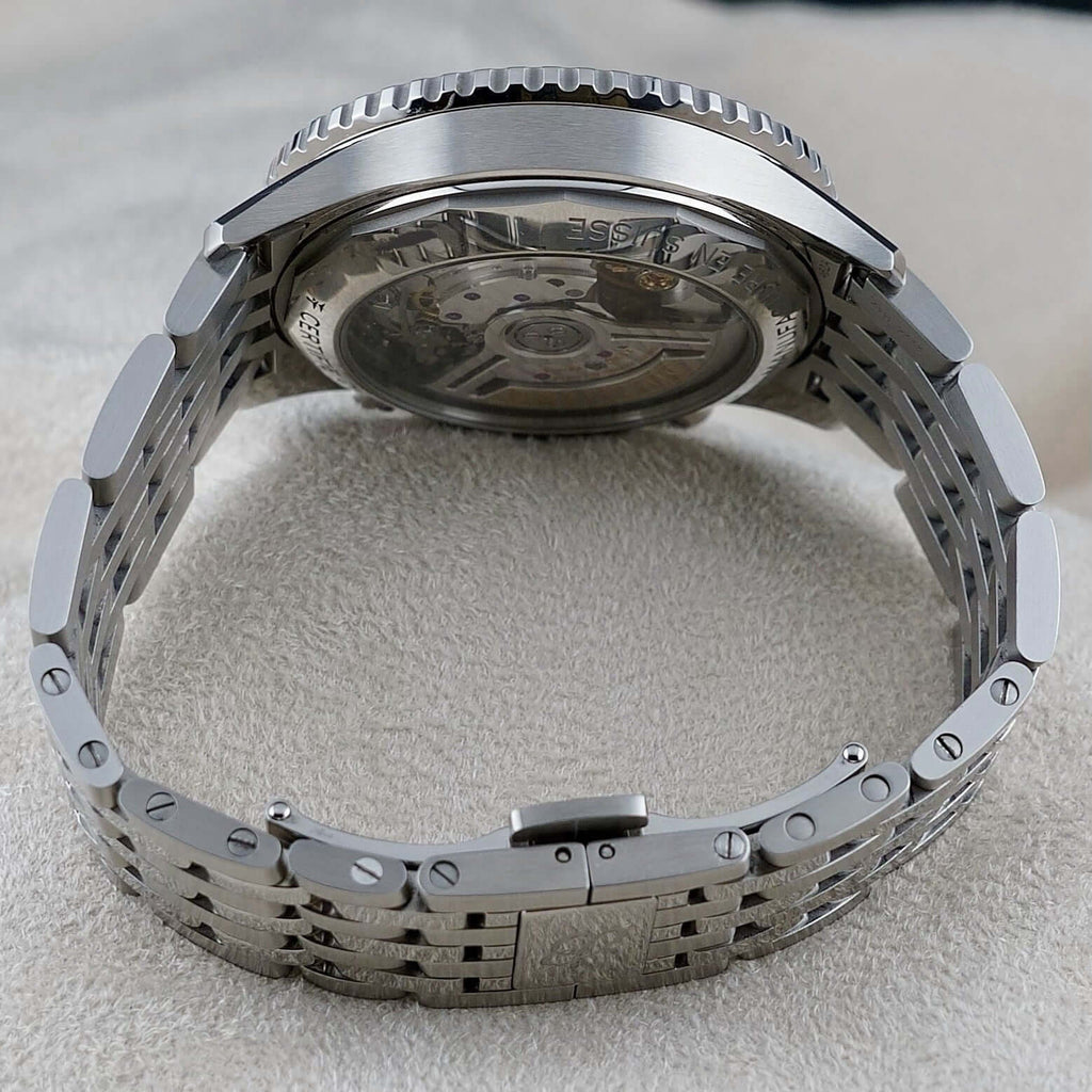 Wrist Flex Timepieces Breitling Navitimer AB0138 stainless steel watch showing the exhibition caseback and rouleaux bracelet