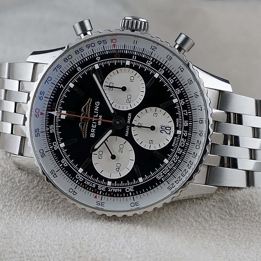 Wrist Flex Timepieces Breitling Navitimer B01 chronograph watch with black reverse panda dial and stainless steel bracelet