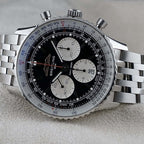 Wrist Flex Timepieces Breitling Navitimer B01 chronograph watch with black reverse panda dial and stainless steel bracelet