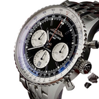 Wrist Flex Timepieces Breitling Navitimer B01 chronograph watch with black reverse panda dial and stainless steel bracelet
