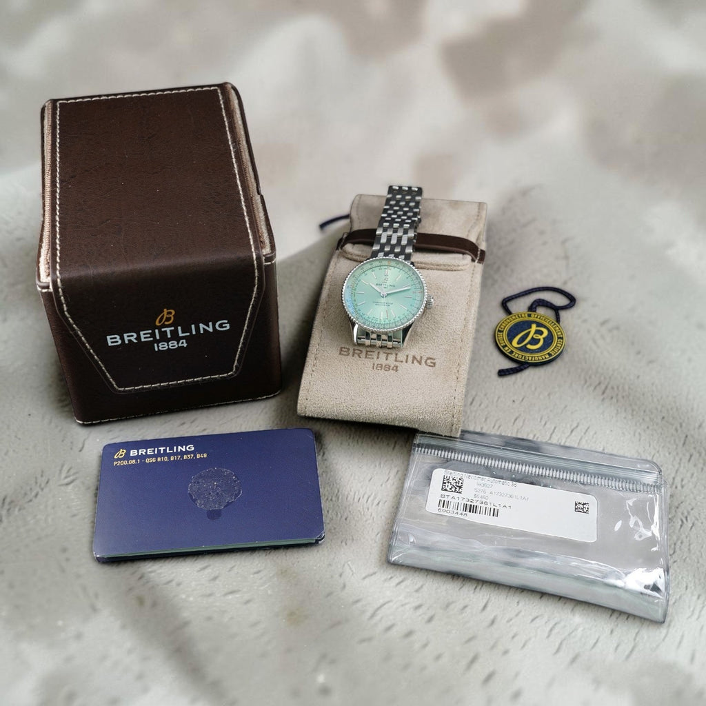 Wrist Flex Timepieces Breitling Navitimer Automatic 36 watch with mint green dial, stainless steel case and bracelet.