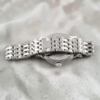 Wrist Flex Timepieces Breitling Navitimer 36 watch showing the stainless steel bracelet and case back detail