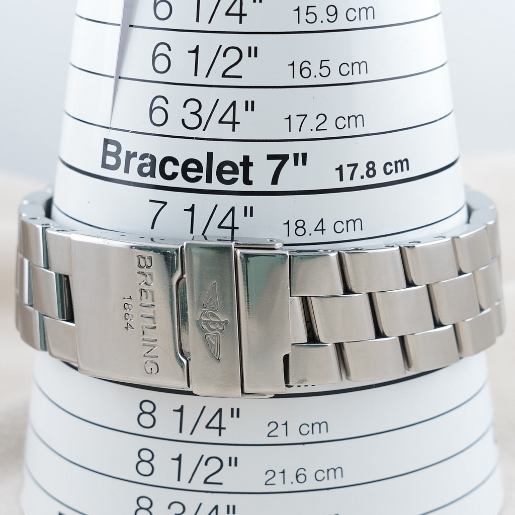 Wrist Flex Timepieces Breitling stainless steel watch bracelet on a sizing cone showing a 7 inch measurement
