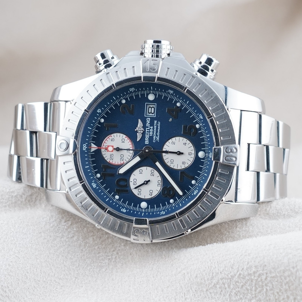 Wrist Flex Timepieces Breitling Super Avenger 48mm chronograph watch with blue dial and stainless steel bracelet.
