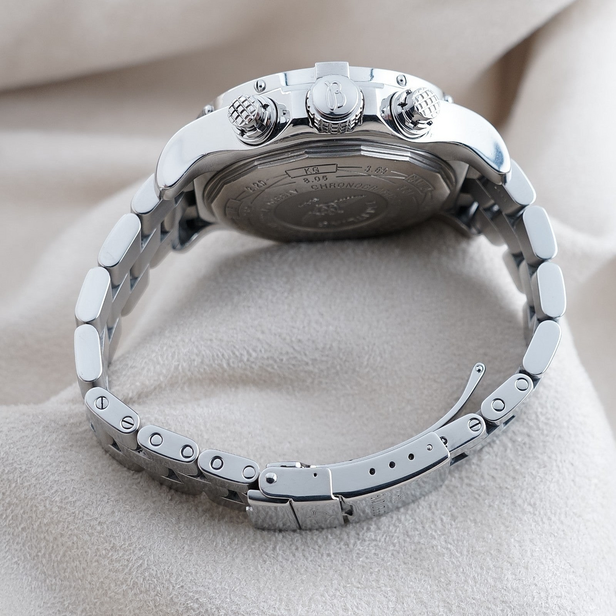 Wrist Flex Timepieces Breitling Super Avenger 48mm chronograph showing the stainless steel case back and bracelet