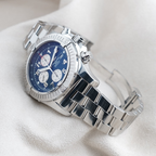 Wrist Flex Timepieces Breitling Super Avenger A13370 chronograph with blue dial and stainless steel bracelet