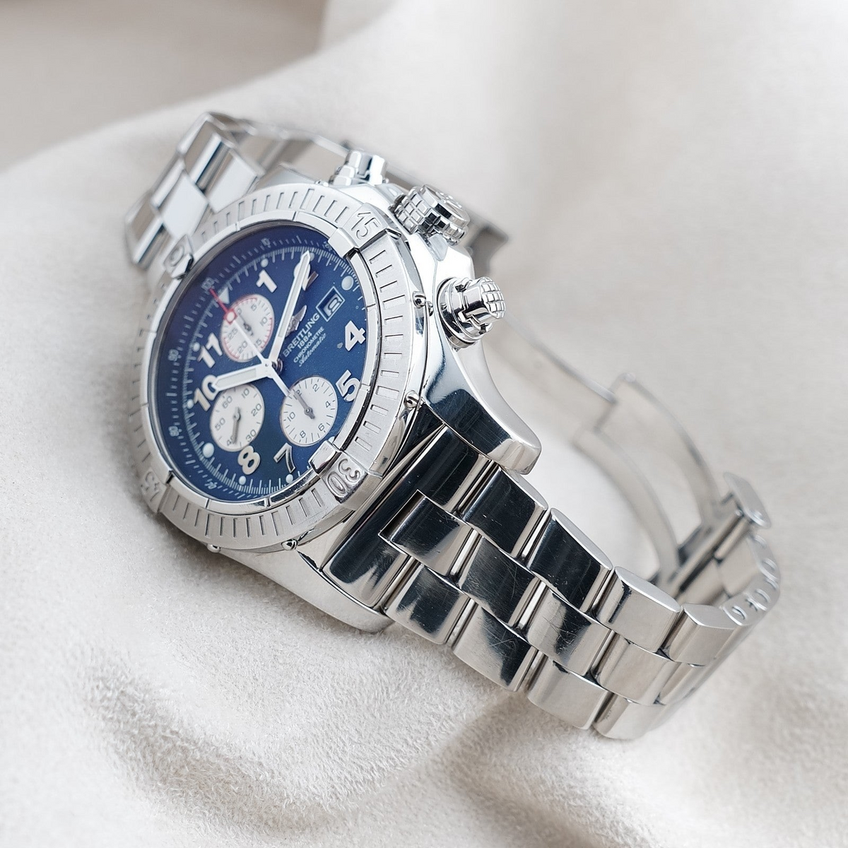 Wrist Flex Timepieces Breitling Super Avenger A13370 chronograph with blue dial and stainless steel bracelet