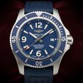 Wrist Flex Timepieces Breitling Superocean 44mm watch with a blue dial and matching blue rubber strap
