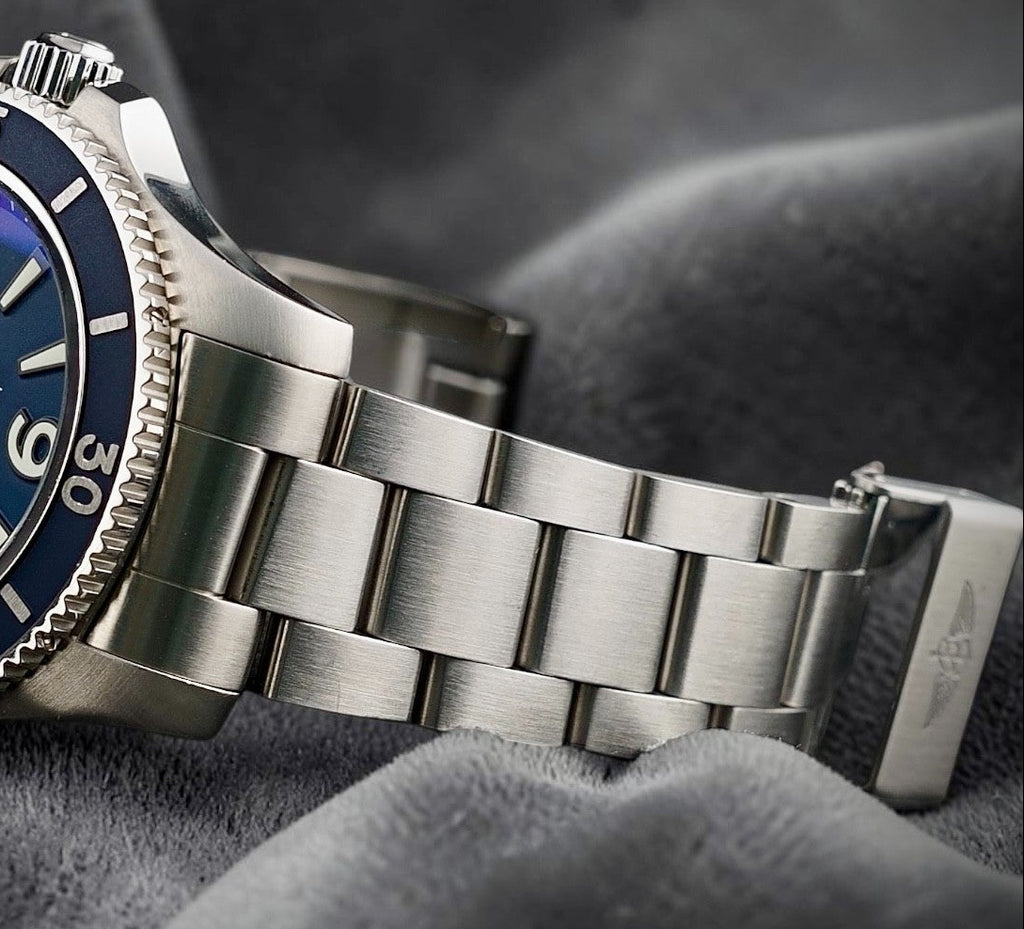 Wrist Flex Timepieces Breitling Superocean 44mm watch with a blue dial and brushed stainless steel bracelet