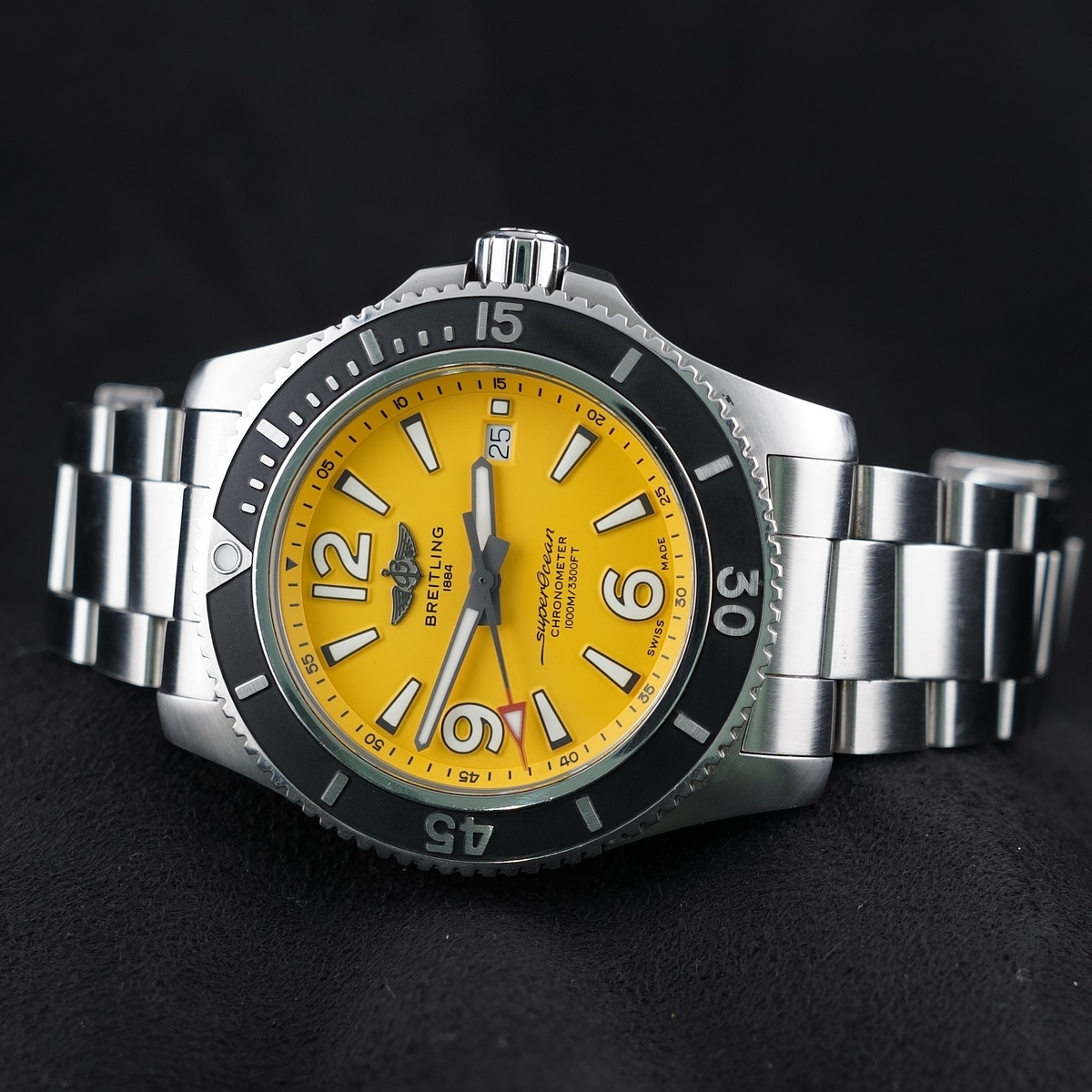 Wrist Flex Timepieces Breitling Superocean 44mm watch with a vibrant yellow dial and stainless steel bracelet