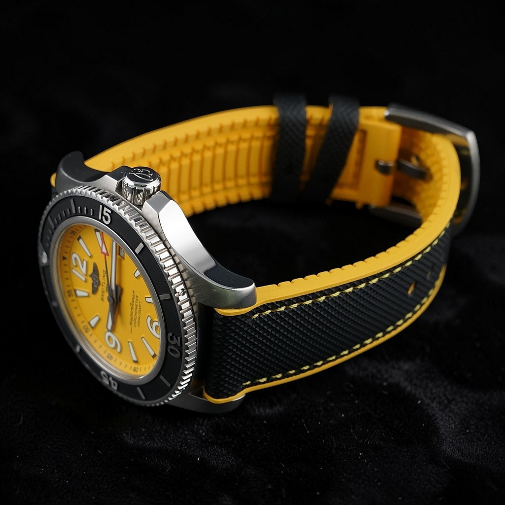 Wrist Flex Timepieces Breitling Superocean 44 watch with a vibrant yellow dial and a black and yellow rubber strap.