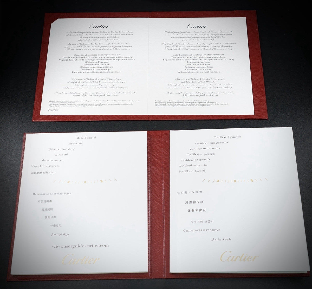 Wrist Flex Timepieces Cartier Calibre de Cartier Diver watch instruction and certificate booklets on a display mat