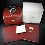 Wrist Flex Timepieces Cartier Calibre de Cartier Diver watch with box, papers, and accessories on a black background.