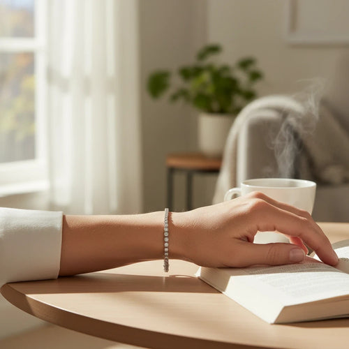 Wrist Flex Timepieces 5.37ct natural diamond tennis bracelet in 14k white gold worn on a woman's wrist while reading