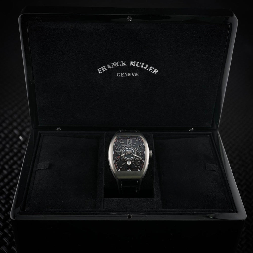 Wrist Flex Timepieces Franck Muller Vanguard V45 titanium watch with black dial displayed in its original luxury box.