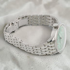 Wrist Flex Timepieces Breitling Navitimer Automatic 36 watch with a mint green dial and stainless steel bracelet