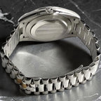 Wrist Flex Timepieces Rolex Day-Date watch showing the back of the case and the iconic President bracelet links.