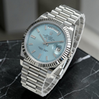 Wrist Flex Timepieces Rolex Day-Date with ice-blue dial, fluted bezel, and baguette diamond markers on President bracelet