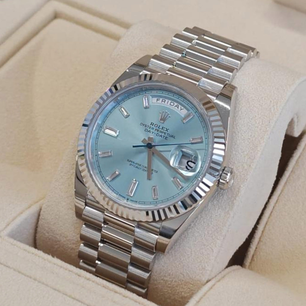 Wrist Flex Timepieces Rolex Day-Date with ice-blue dial, baguette diamond markers, fluted bezel, and President bracelet