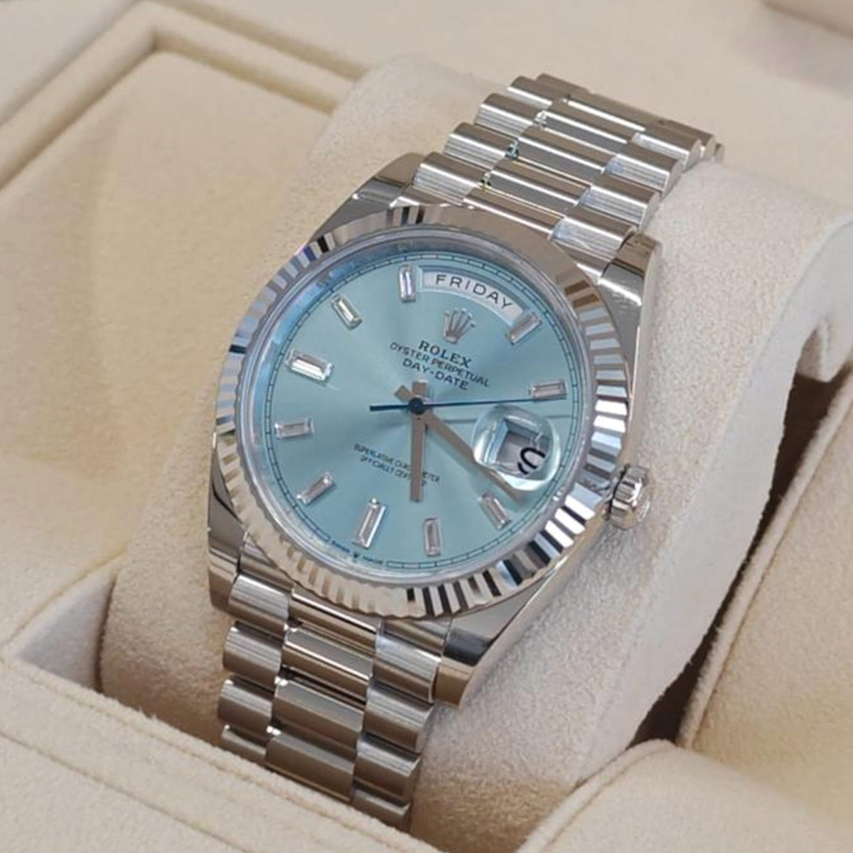 Wrist Flex Timepieces Rolex Day-Date with ice-blue dial, baguette diamond markers, fluted bezel, and President bracelet