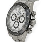 Wrist Flex Timepieces Rolex Cosmograph Daytona with white dial, black sub-dials, and black ceramic bezel on steel case.