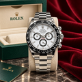 Wrist Flex Timepieces Rolex Daytona 116500LN with white dial, black sub-dials, and ceramic bezel in a full set box.