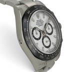 Wrist Flex Timepieces Rolex Daytona 116500LN watch with white dial, black sub-dials, and ceramic bezel on steel bracelet